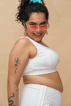 Woman wearing a white top and bottoms