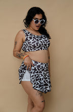 Woman wearing a cow print top and bottom