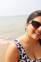 Woman in a cow print top 