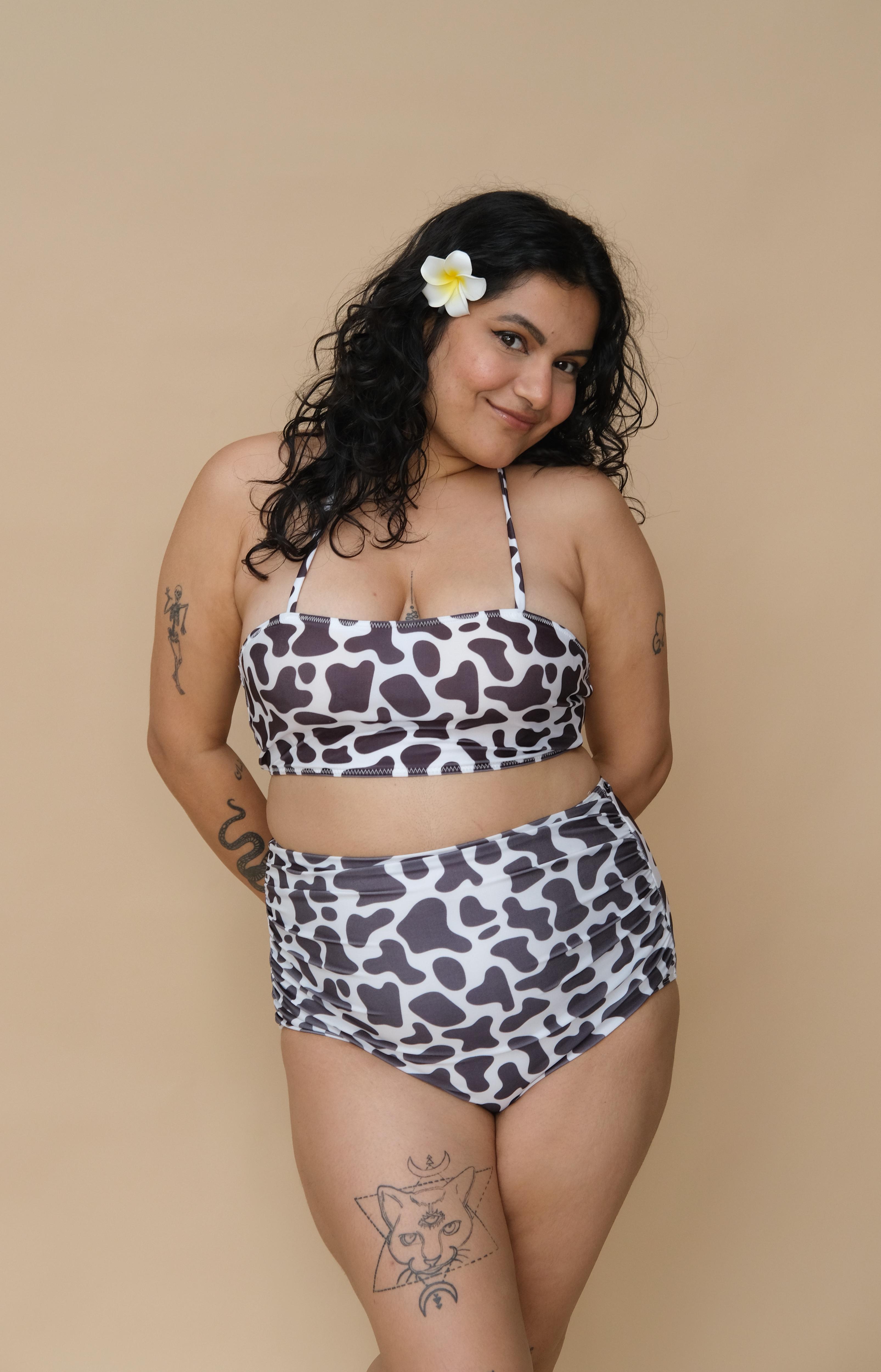 Woman wearing a cow print bikini set 