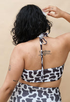 Woman wearing a black and white patterned bikini set 