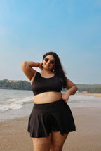 Plus size woman in black beachwear