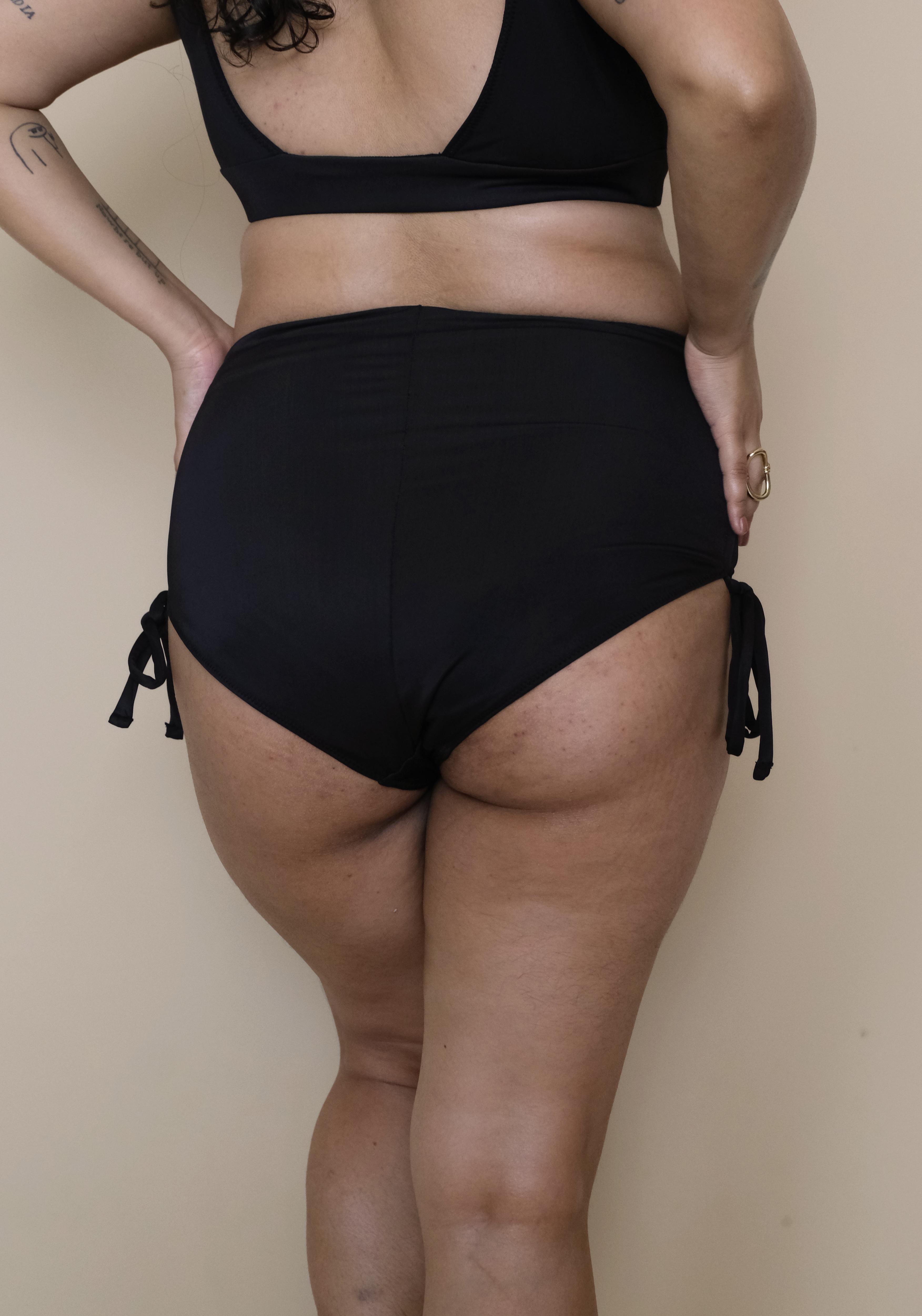 Plus size Asian woman wearing a black bikini 