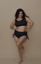 Woman wearing a black bikini set