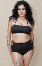 Woman wearing a black bikini set