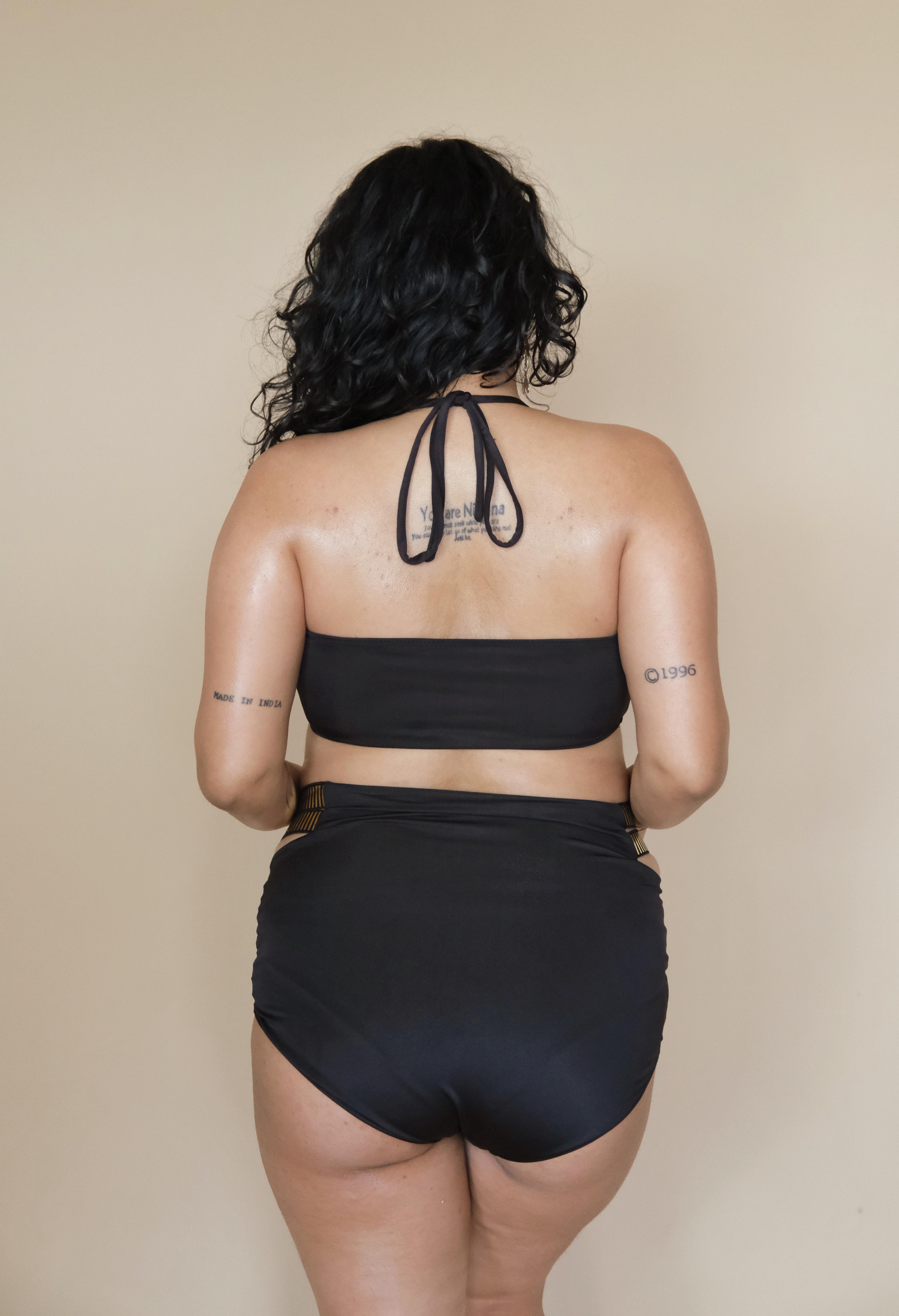 Woman wearing a black bikini set 