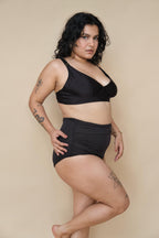 Woman wearing a black bikini set