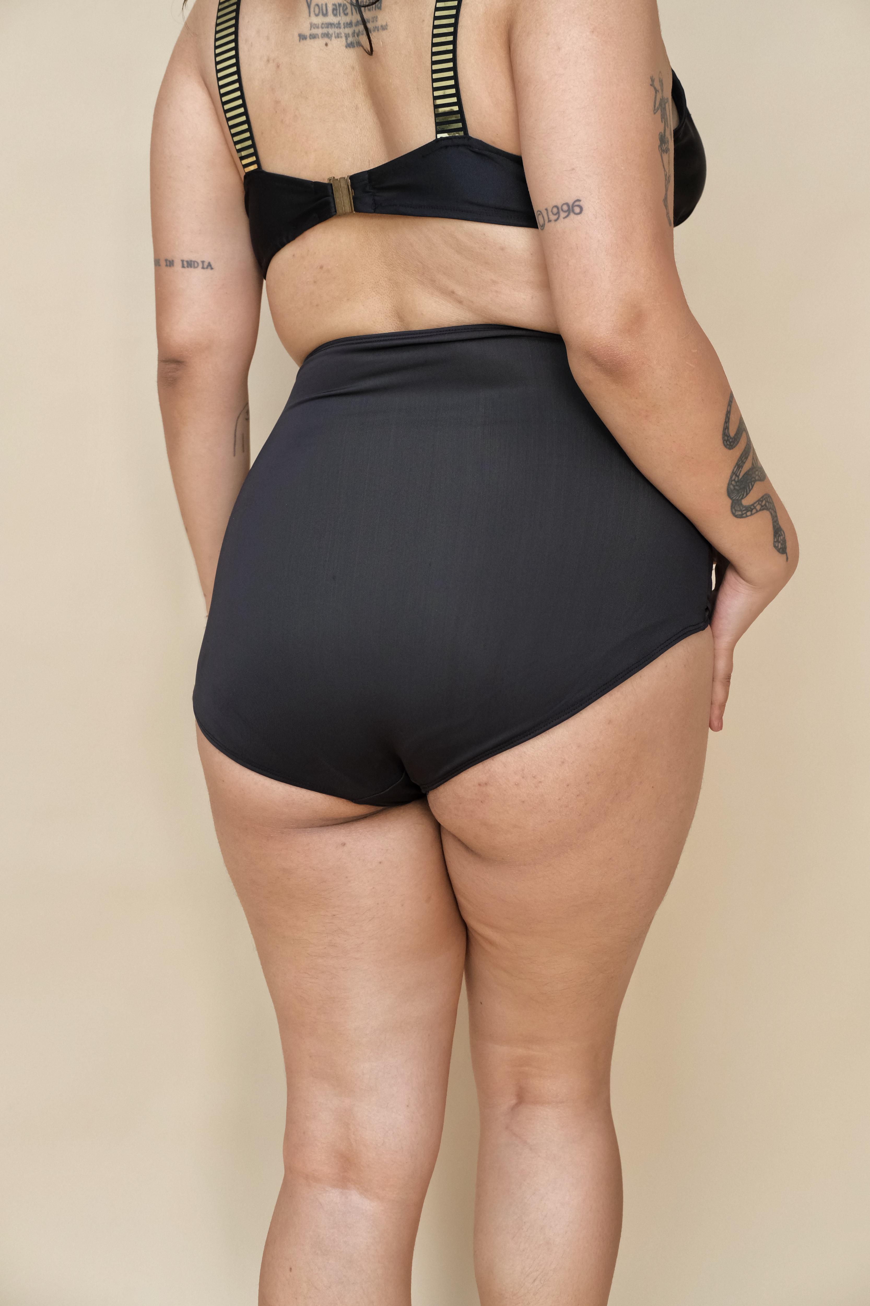 Woman wearing a black swimsuit 