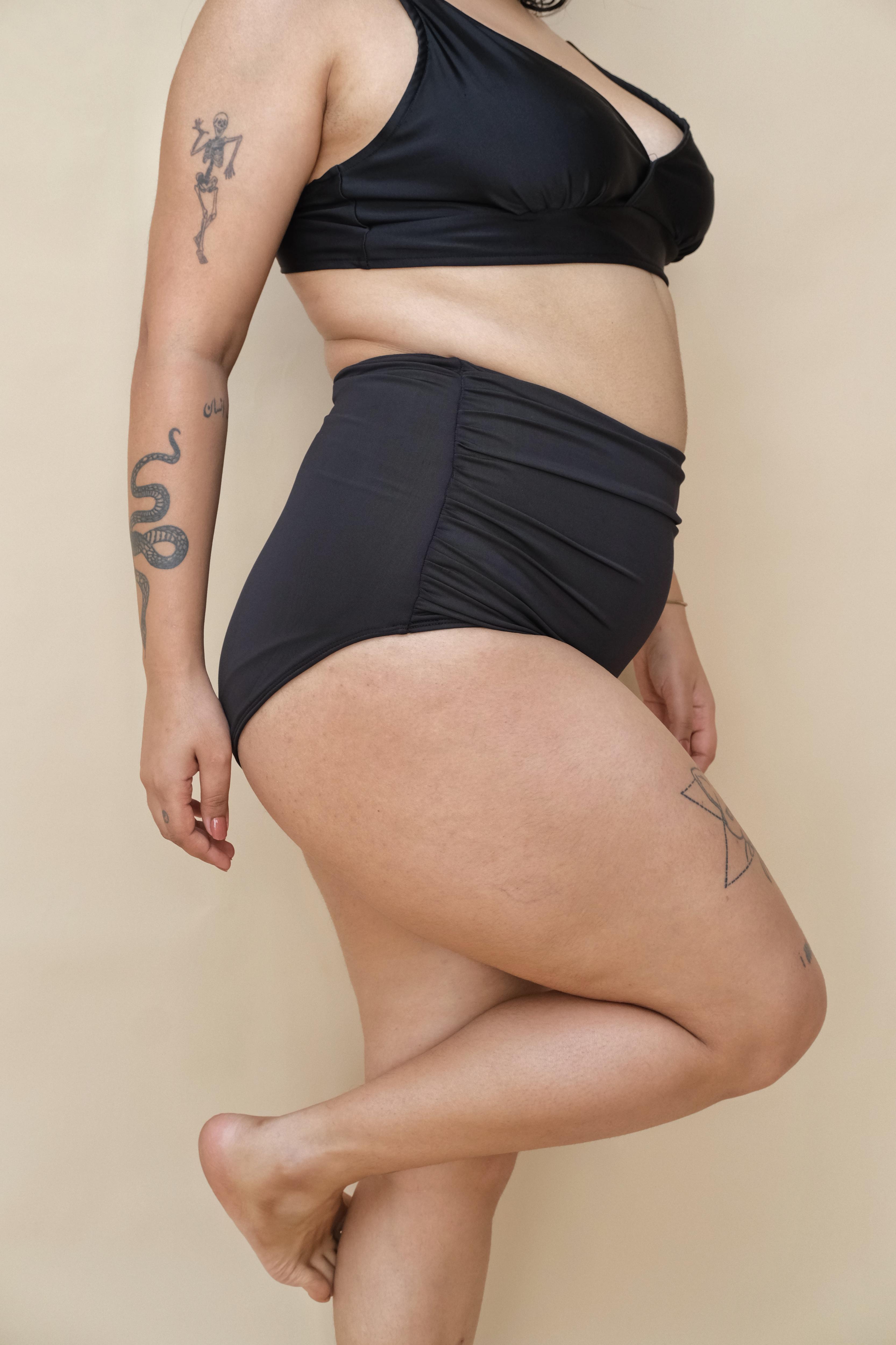 Curvy woman wearing a black bikini set