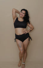 Woman wearing a black bikini 