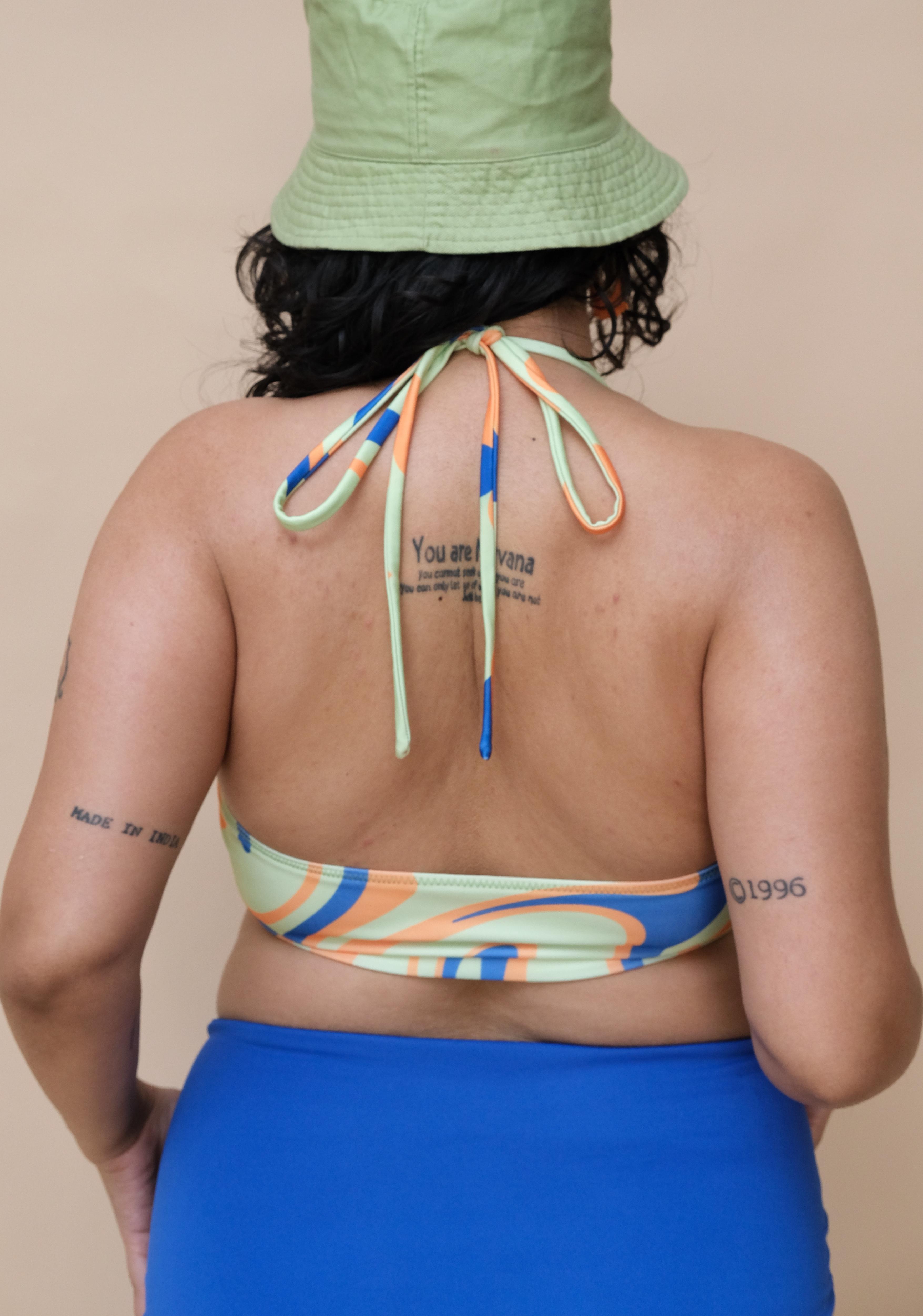 Woman  wearing a colourful bikini top 