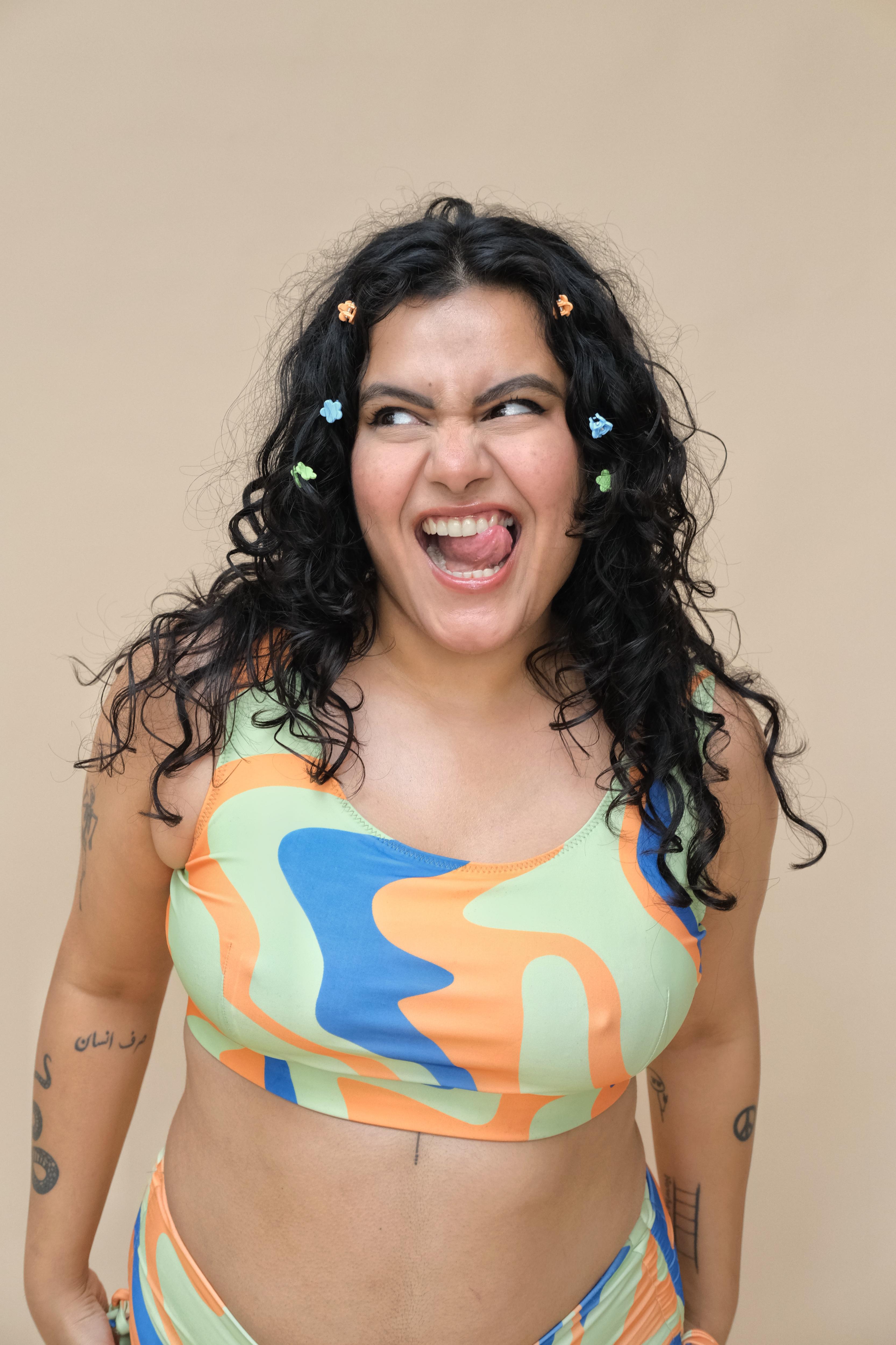 Woman wearing a colourful bikini round neck top