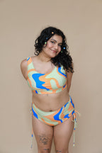 Plus size woman wearing a colorful bikini set