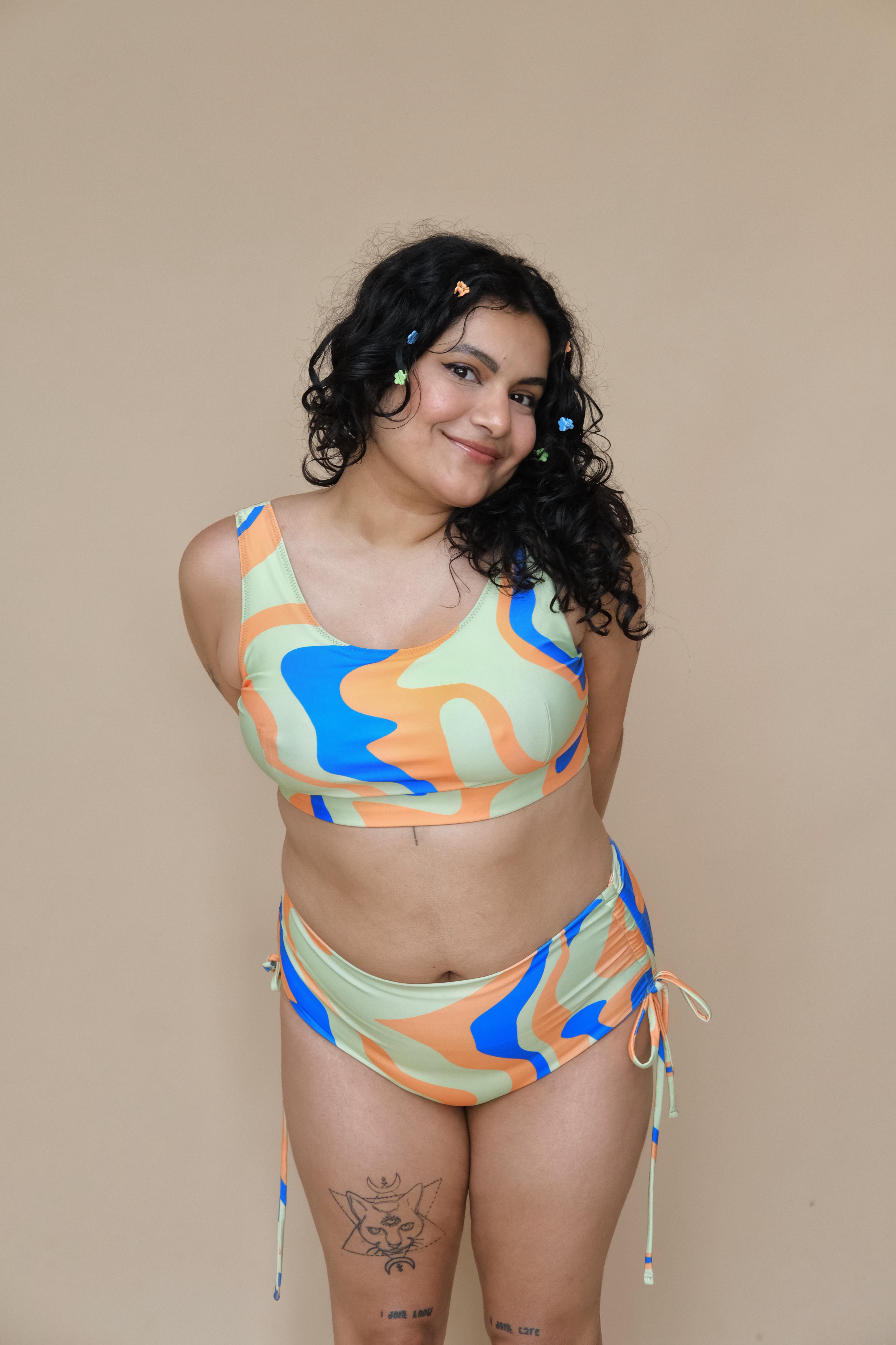 Plus size woman wearing a colorful bikini set