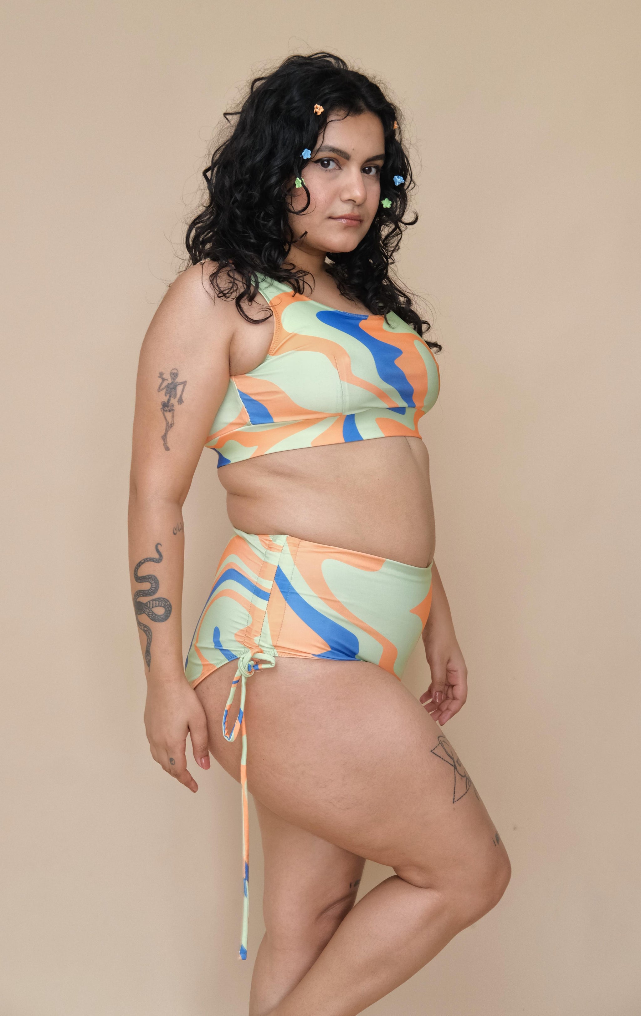 Plus size woman wearing a colorful bikini set 