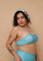 Plus size Asian woman wearing a blue bikini