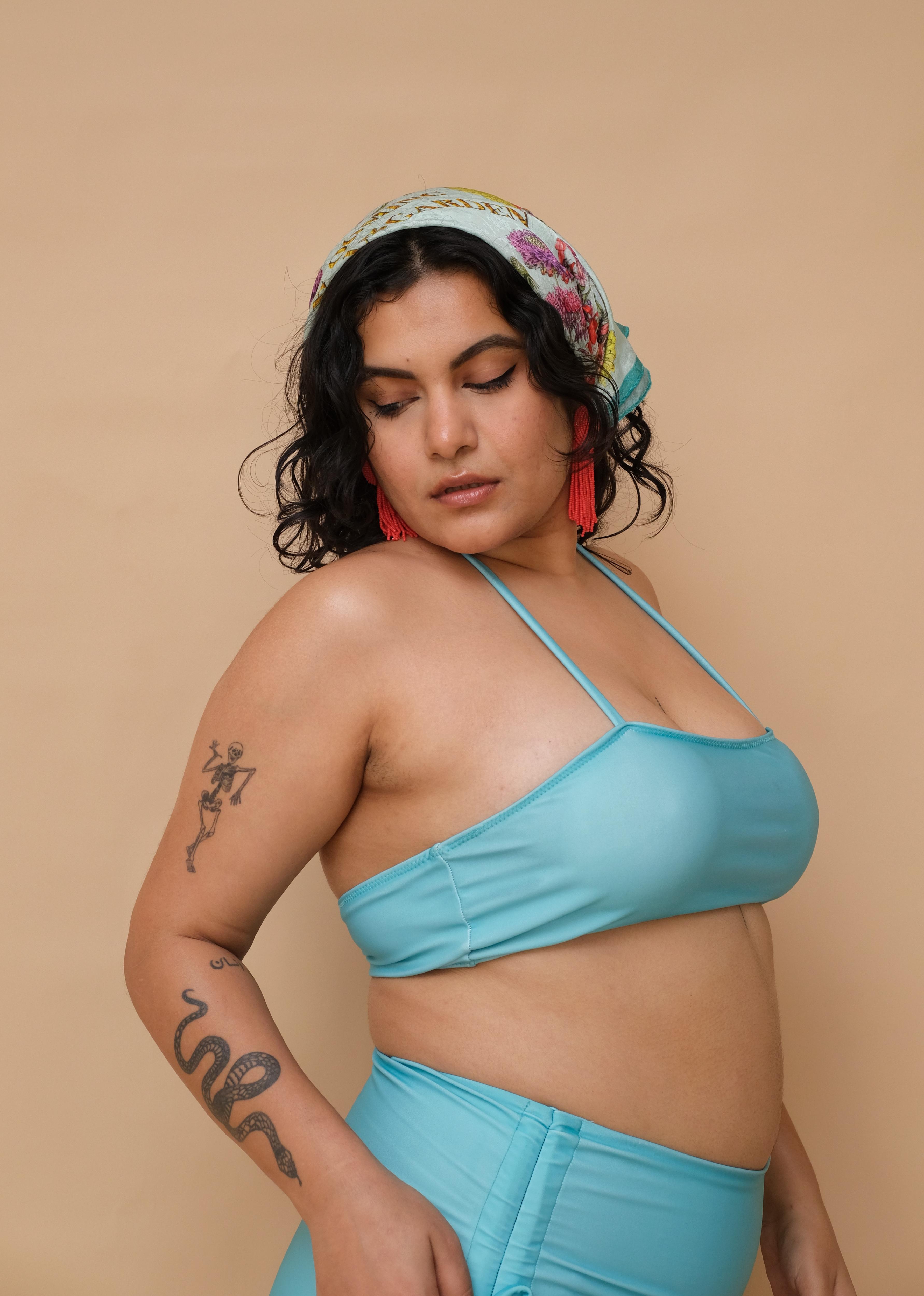 Plus size Asian woman wearing a blue bikini