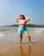 Woman in a colorful top and blue shorts 