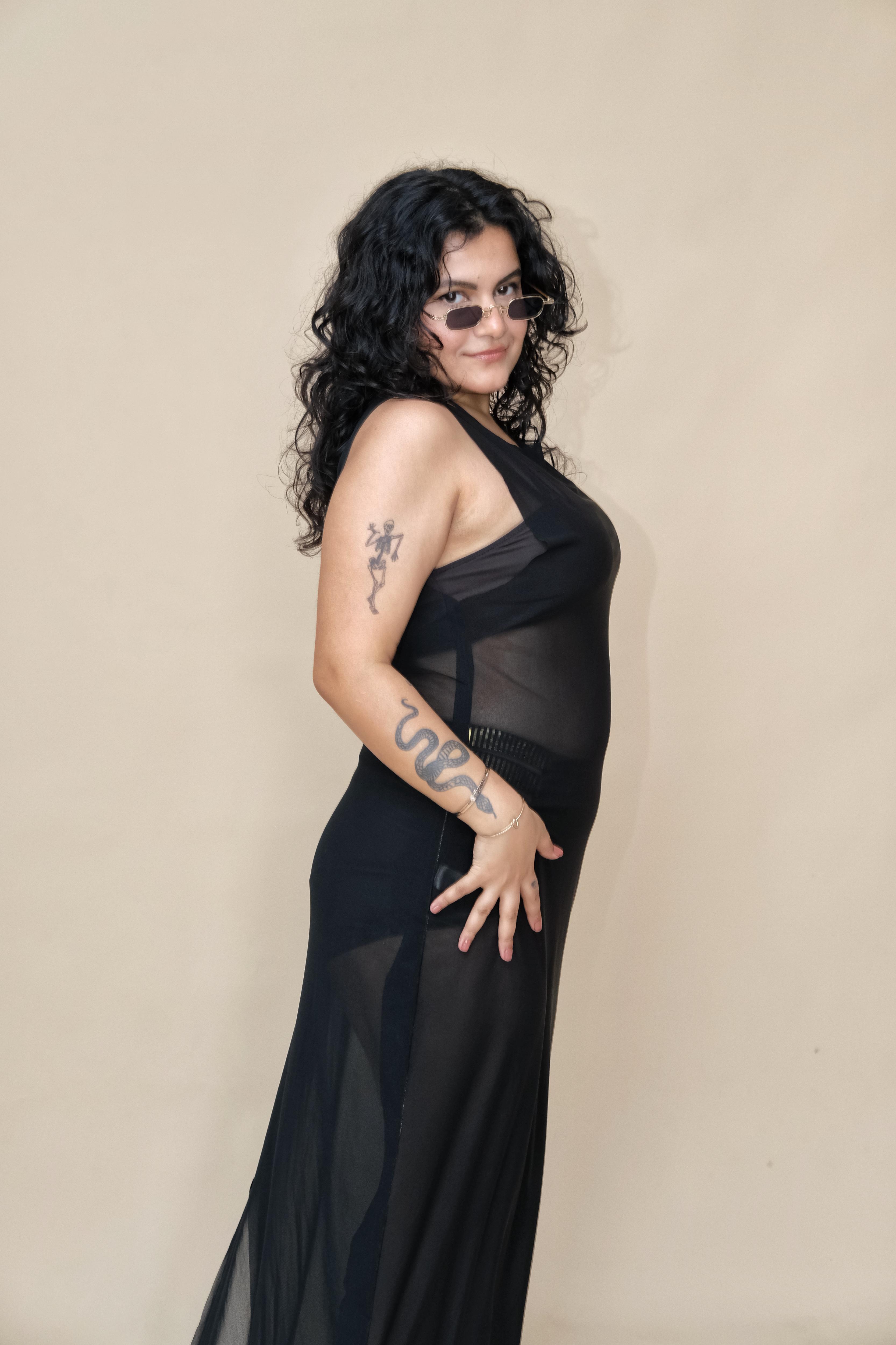Woman wearing a black sheer dress 
