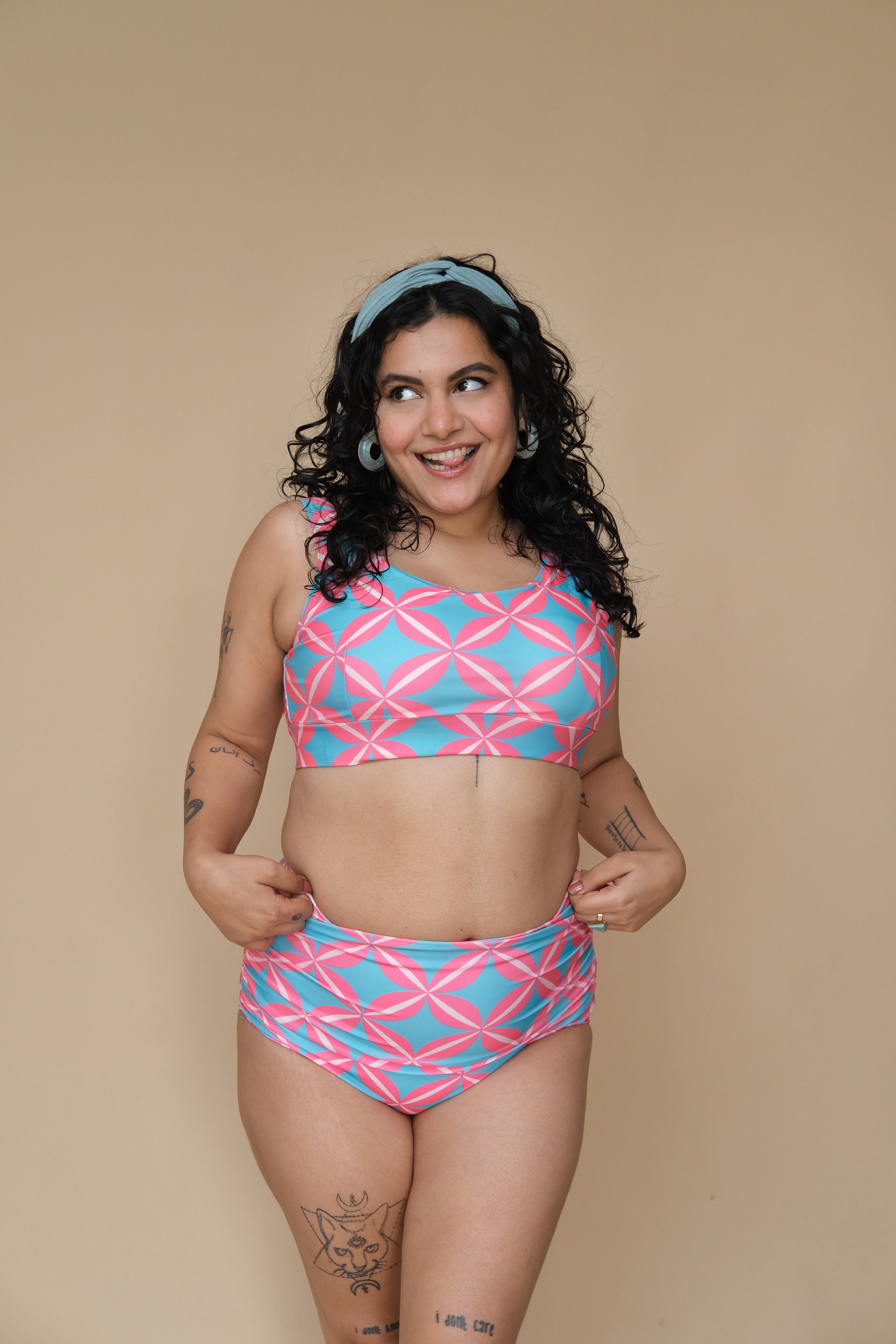 Woman wearing a pink and blue patterned bikini set 