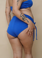 Plus size wearing a blue bikini 