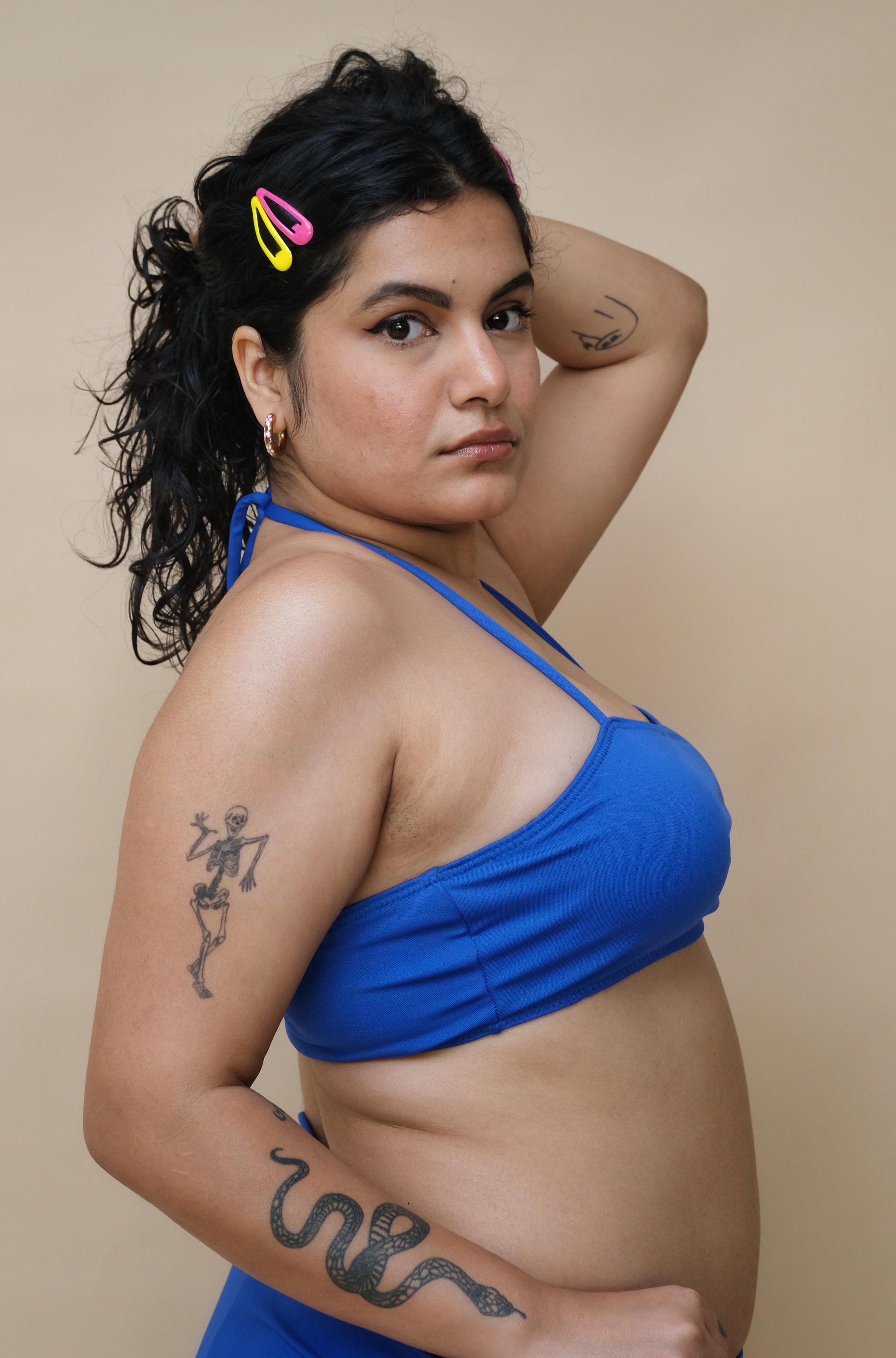 Woman wearing a blue bikini top 