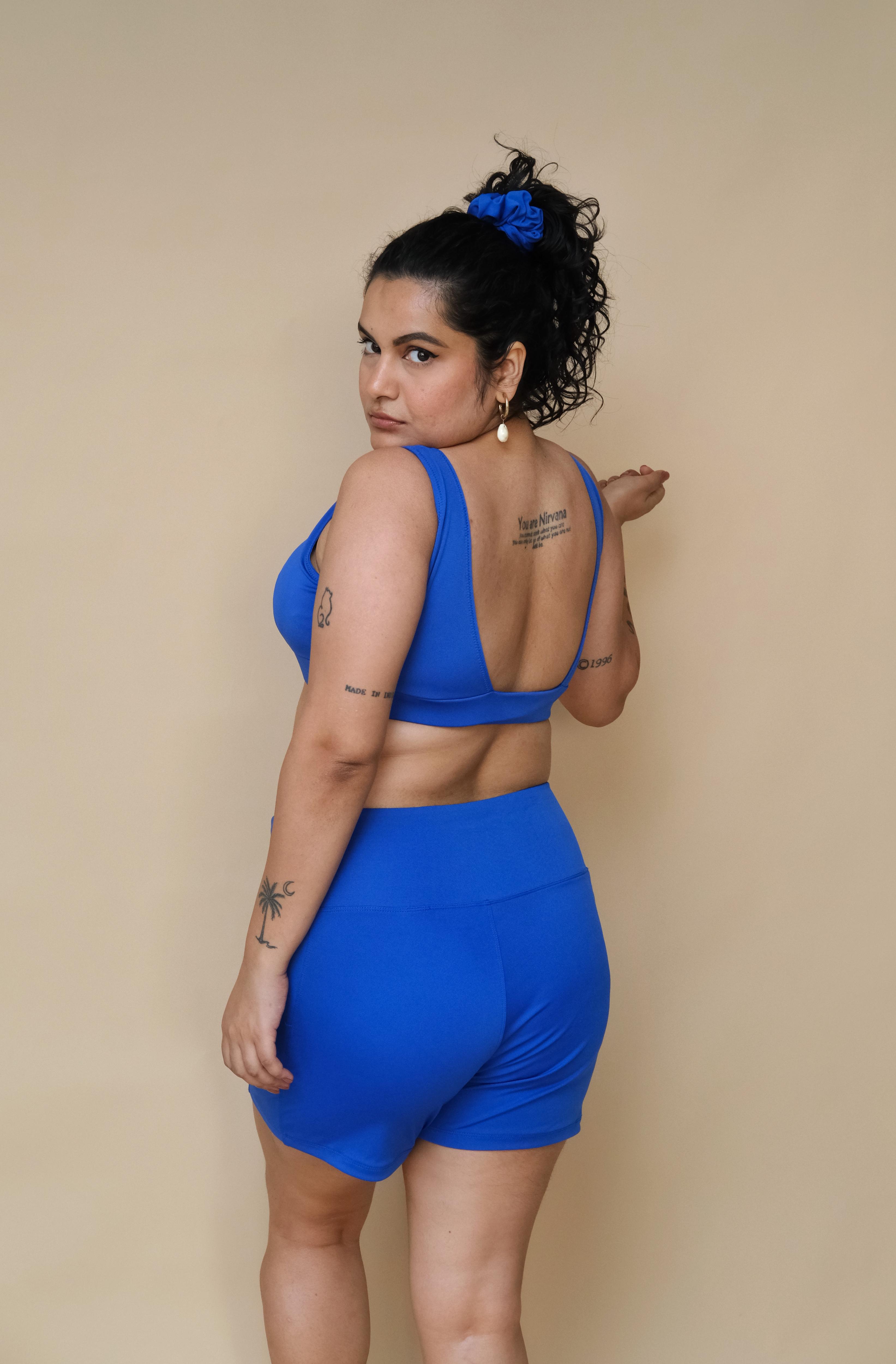 Woman wearing a blue round neck and shorts set 