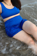 Woman wearing a blue swimsuit set