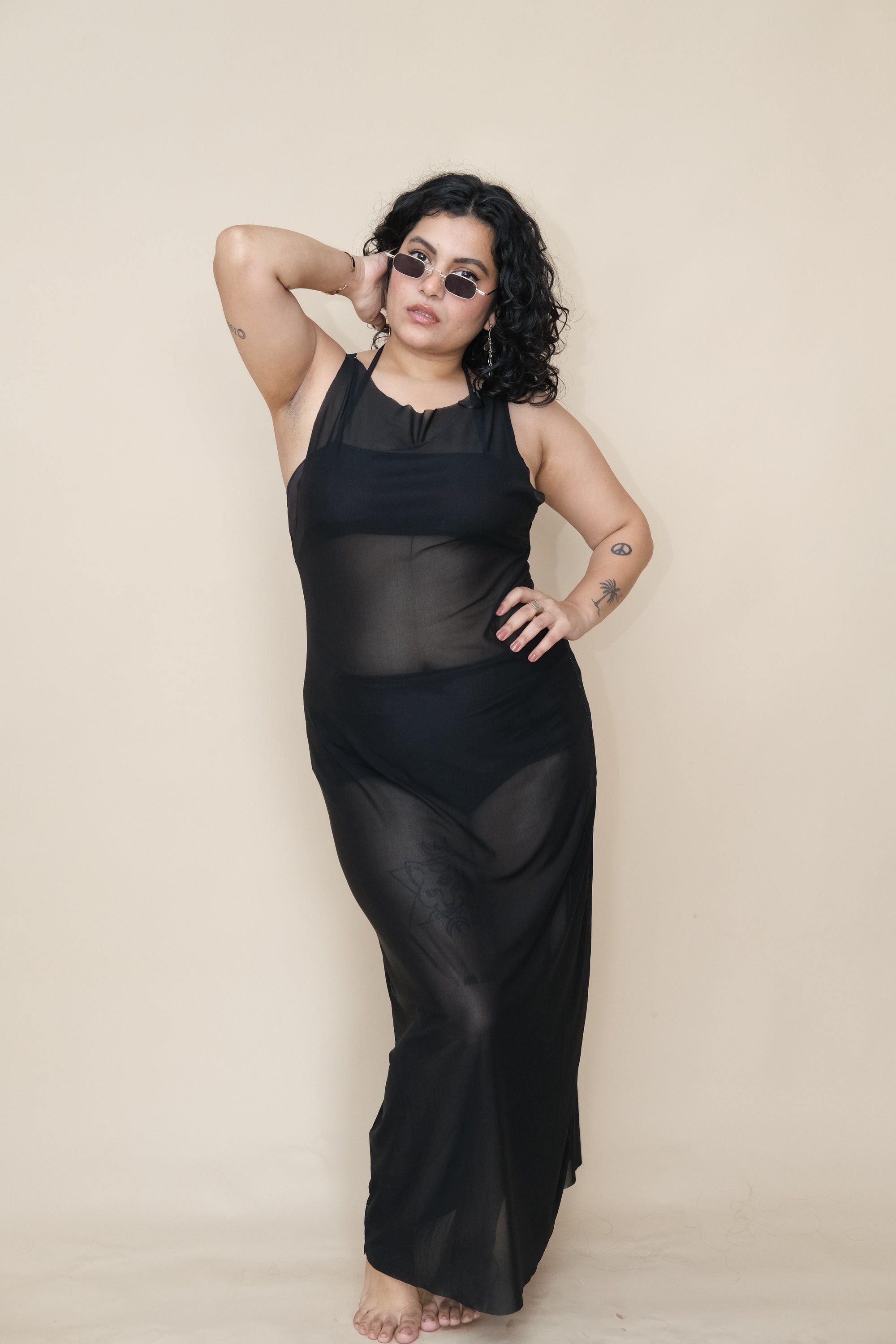 Woman wearing a black sheer dress 