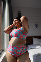 Woman wearing a pink and blue patterned bikini set