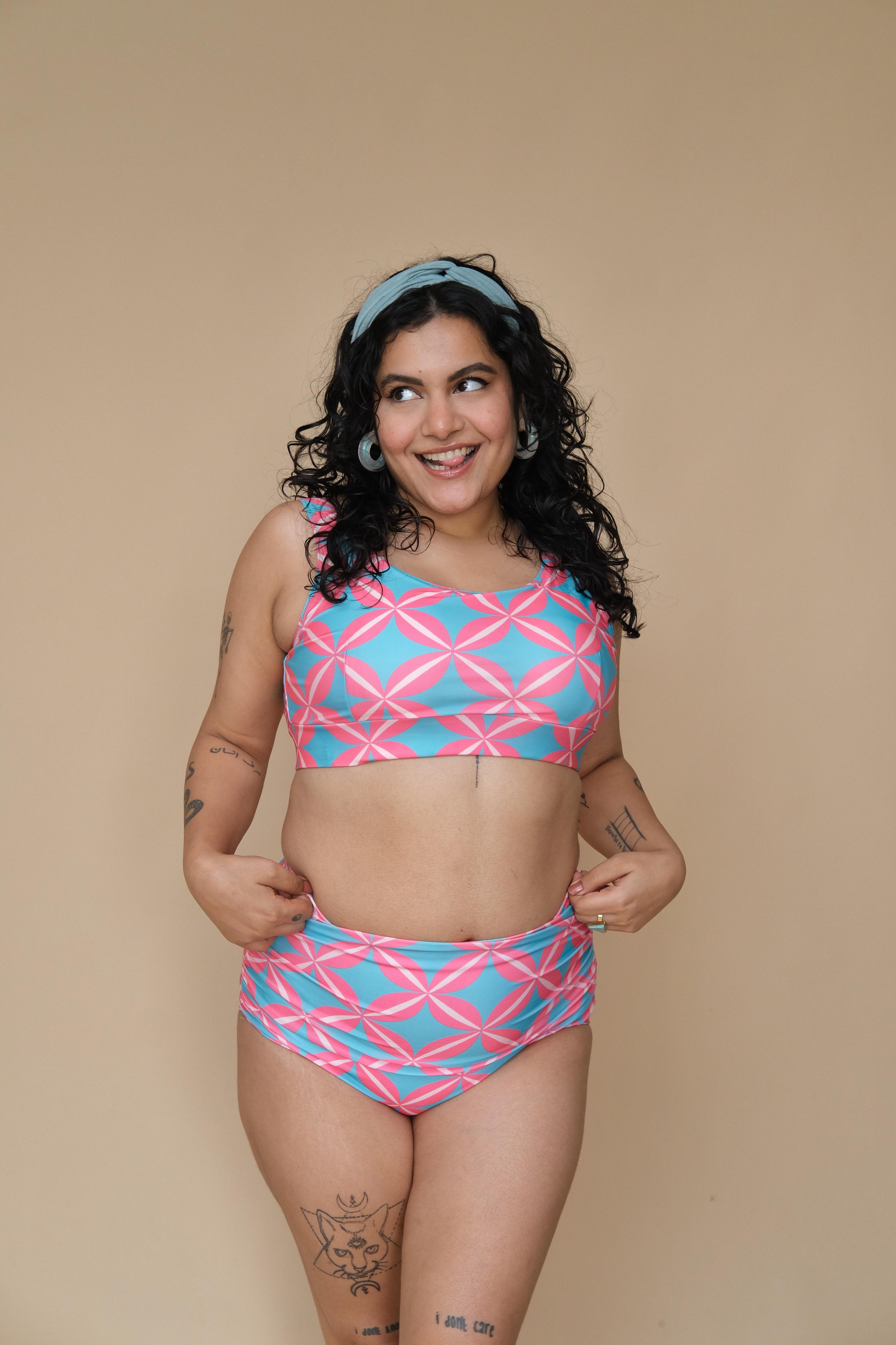Woman wearing a pink and blue patterned bikini set 