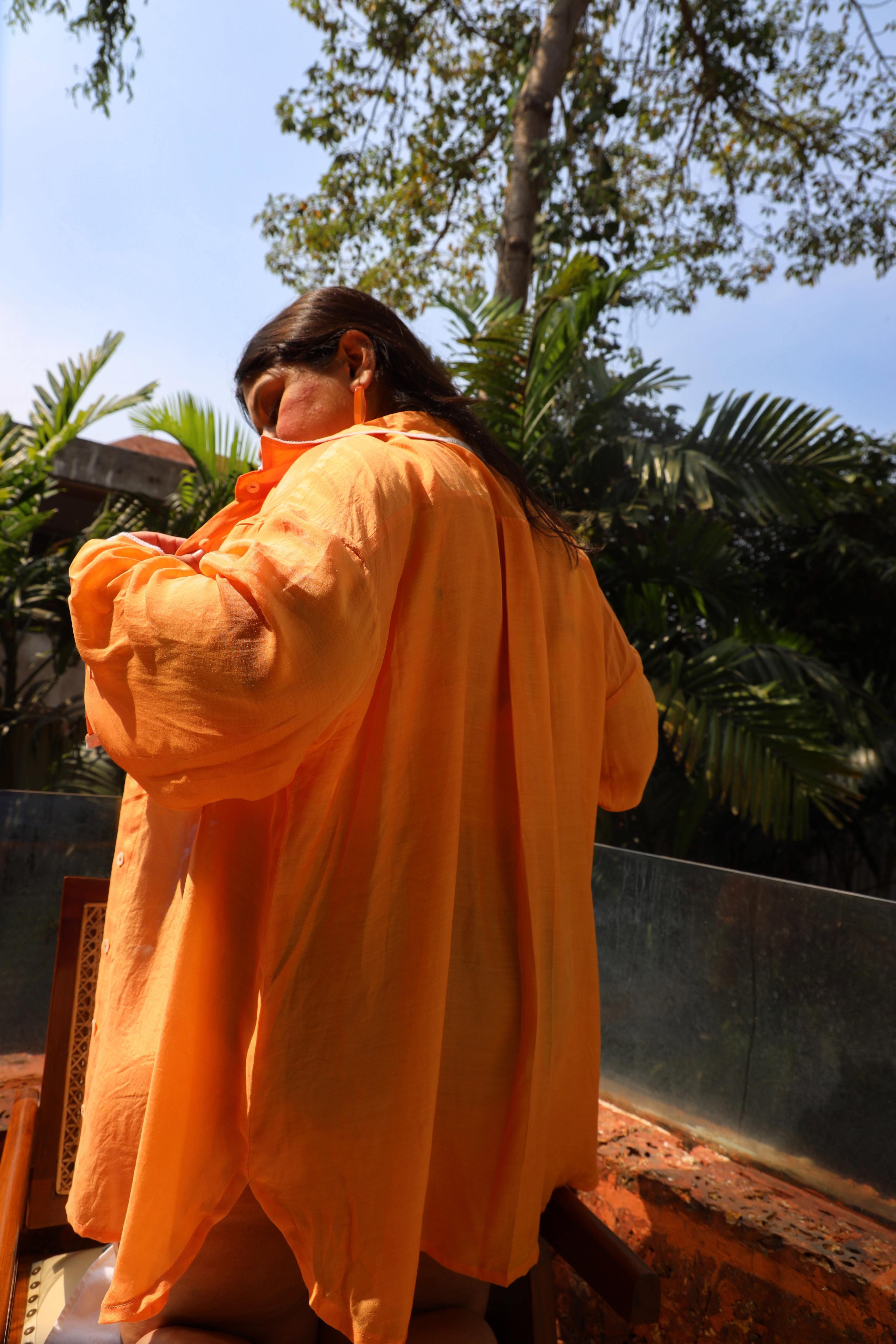 Woman in an orange robe
