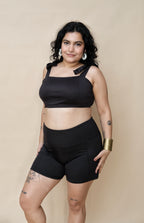 Woman wearing a black swimwear set