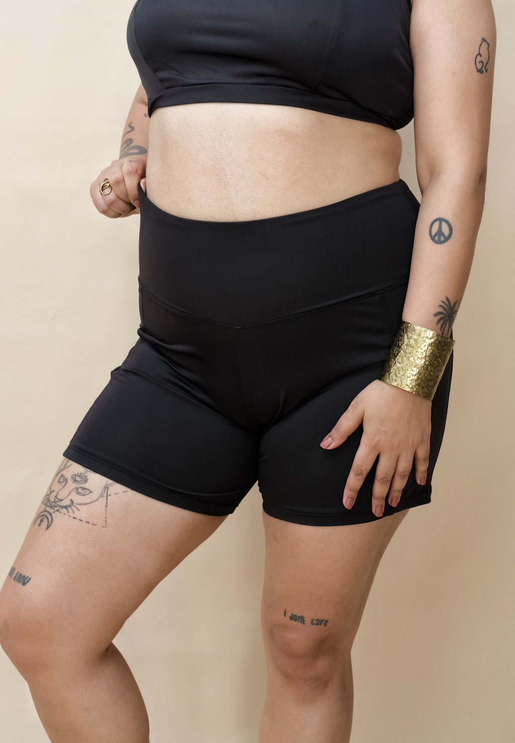 Woman wearing black shorts and top 