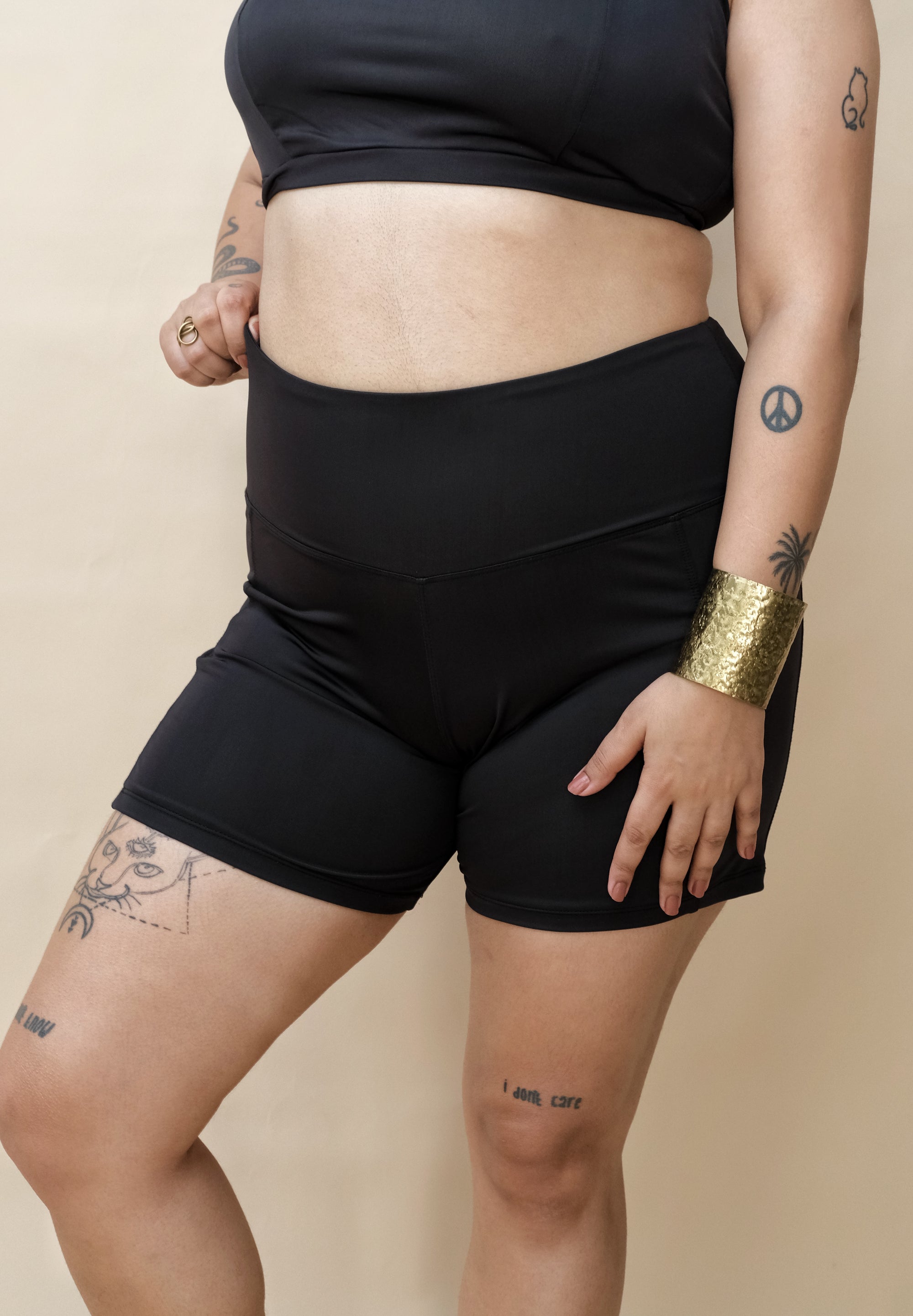 Woman wearing black shorts and top 