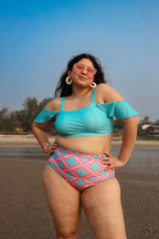 Woman in a blue and pink bikini set
