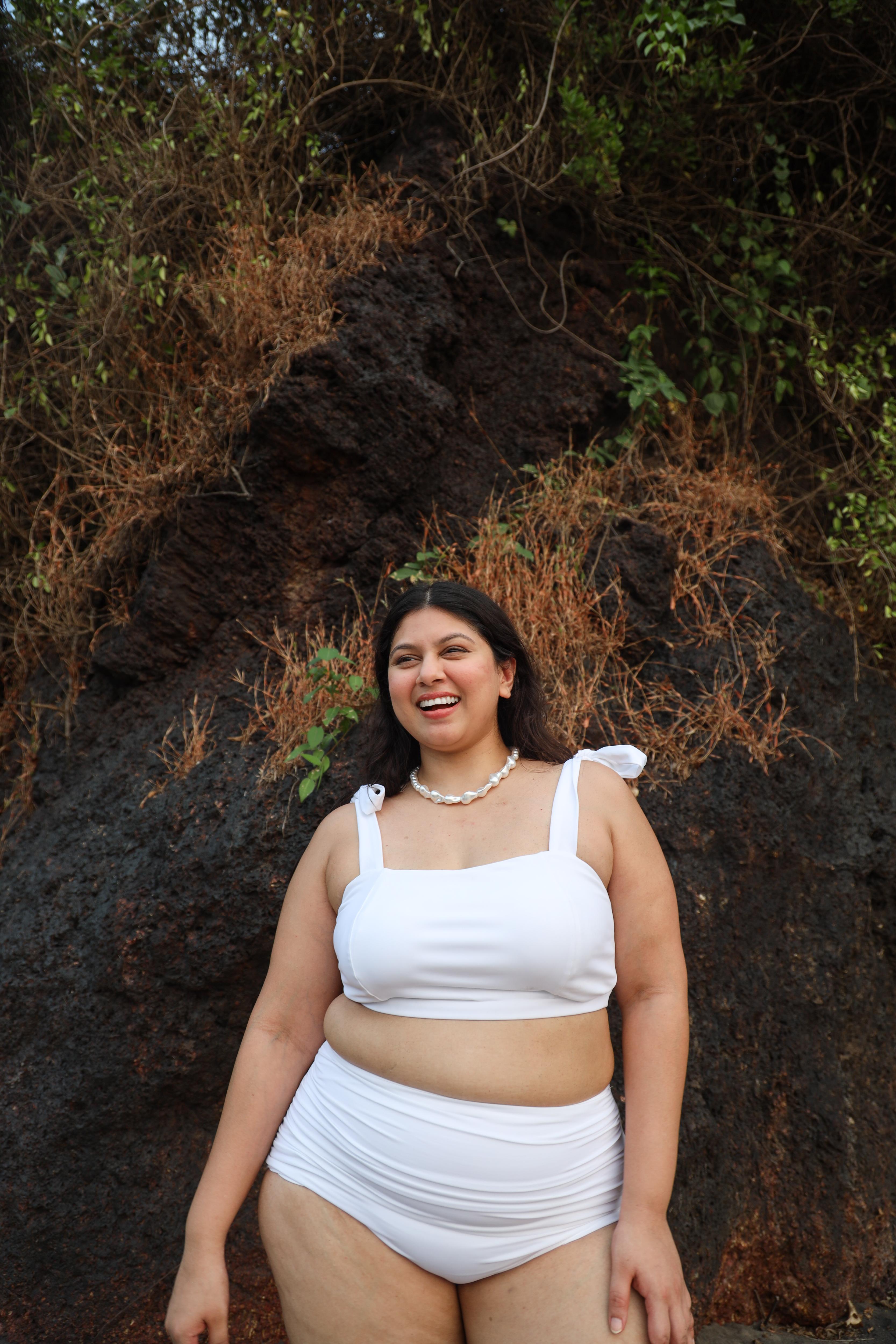 Curvy woman wearing a white bikini set