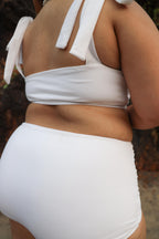 Curvy woman wearing white bikini 