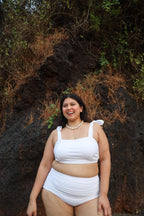Woman wearing a white bikini set
