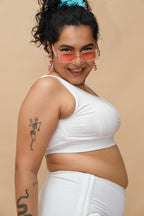 Woman wearing a white top and bottom 