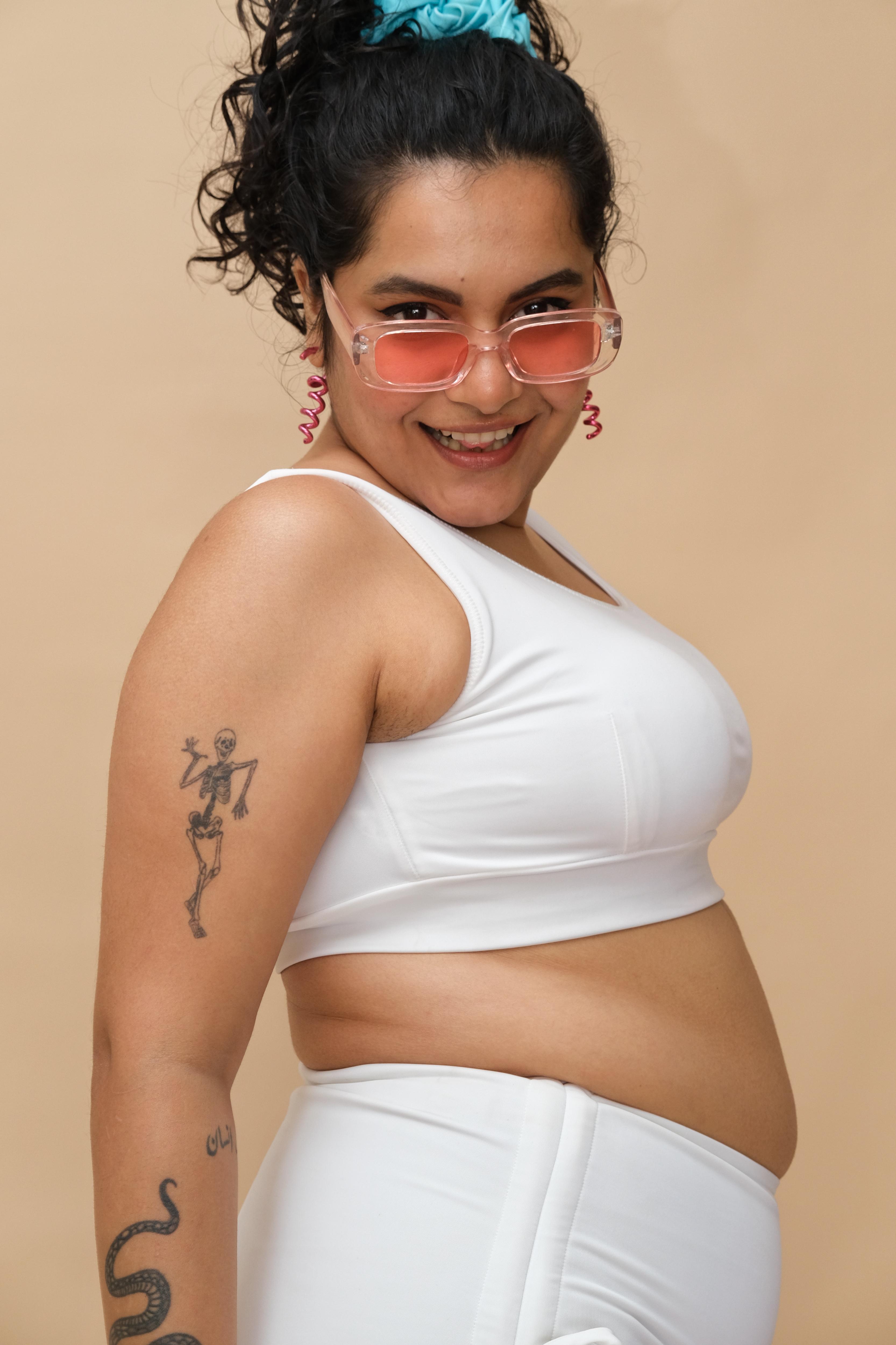 Woman wearing a white top and bottom 