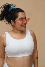 Woman wearing a white tank top